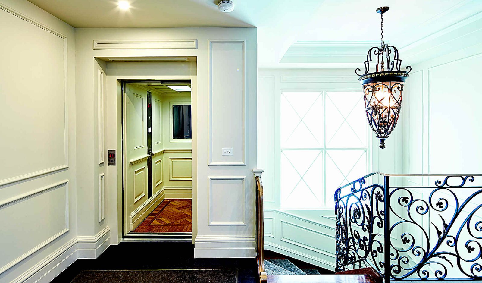 Home lift in a classic hallway with light walls